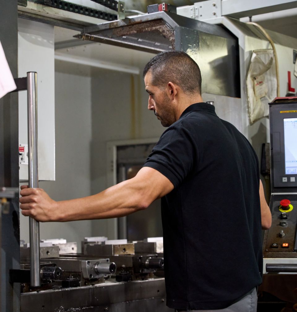 Man Working On Machine